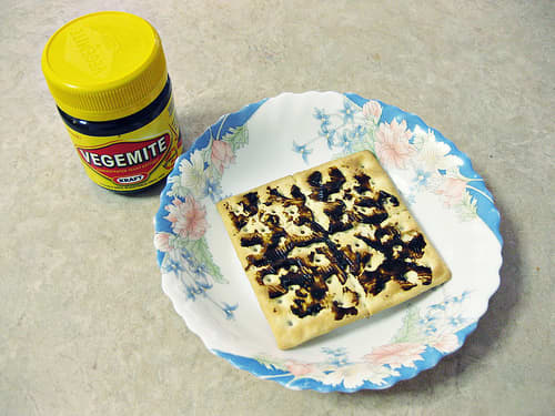 Vegemite on the classic Aussie square cracker - Saladas! A bit of a thicker spread of margarine or butter and some cheese goes well with this kind of cracker/biscuit to add enough thickness to make a Salada 'sandwich' using 2 Saladas.