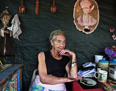 Mara Udwesthuizen, 64, sits outside her tent home at a squatter camp for poor White south African at Coronation Park in Krugersdorp