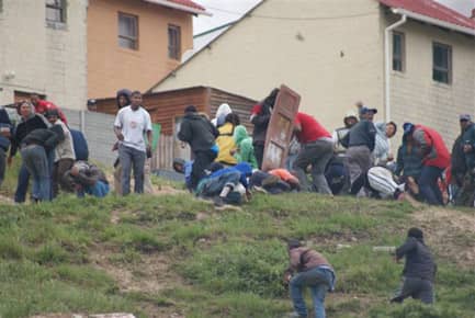 Anti-eviction forces, accompanied by the police, invaded the community of Hangberg to demolish poor people's homes