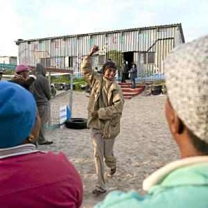 People wait in long queues to vote in Khayelitsha, where a court judgement three weeks ago slammed the DA for erecting unenclosed toilets, as seen in the picture above