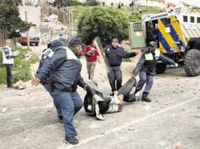 Angry Hangberg residents in Hout Bay have accused Premier Helen Zille of declaring Martial Law and using brute force to evict them from their homes