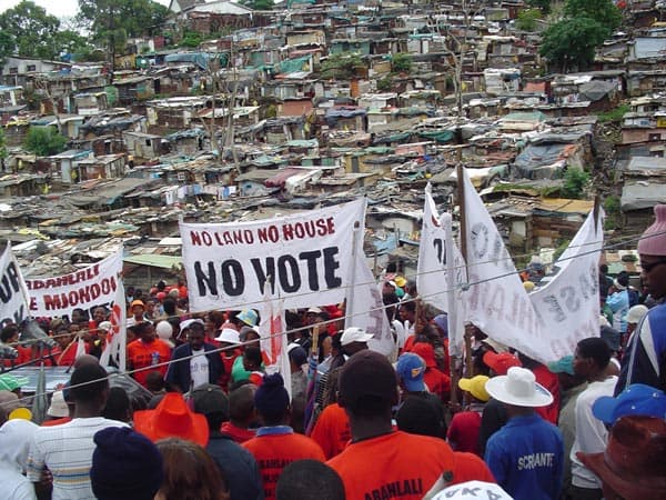 Abahlali basMjondolo and other Shantytowns protesters display their disgruntlement with the ANC with Shantowns as their backdrop and mise en scene