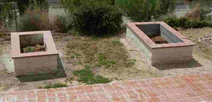 the two ornamental raised beds I had built shortly after completion. The one on the right is bigger than the one on the left.