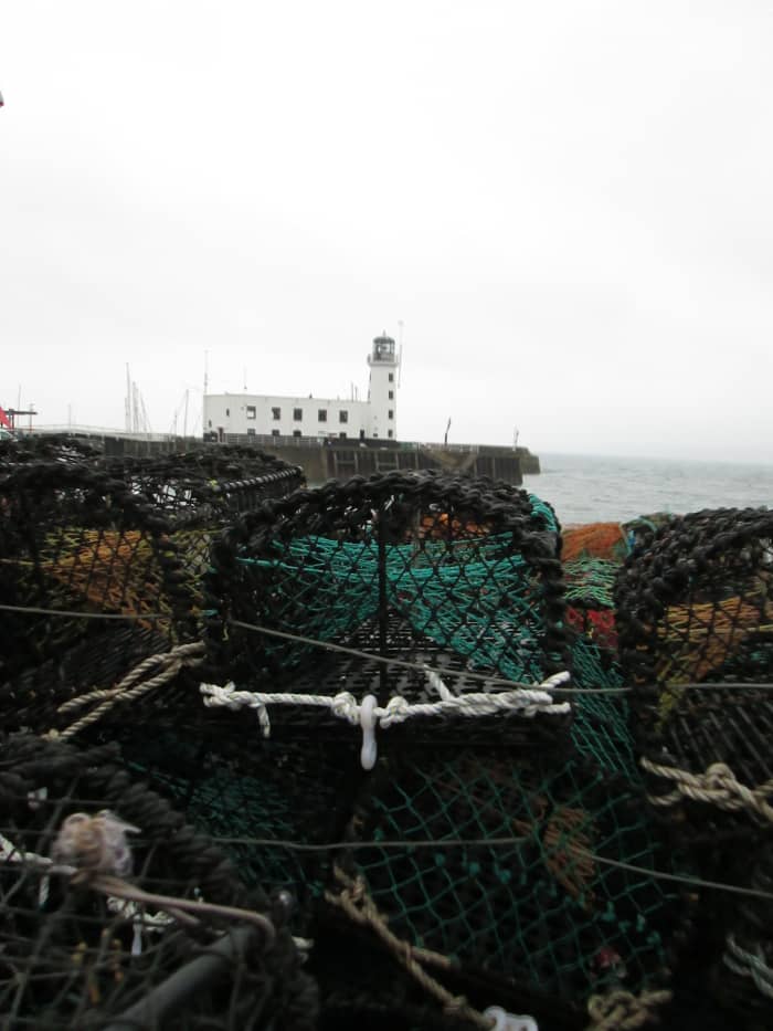 A view of the lighthouse from across some of the crab and lobster traps on the Fish Quay