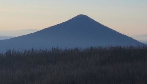 Seen above is Black Butte, with a nearly 7000 foot (above sea level) summit Below is Mt Washington with a similar elevation. The two peaks are located about ten miles apart and illustrate the different climates of western and eastern Oregon.