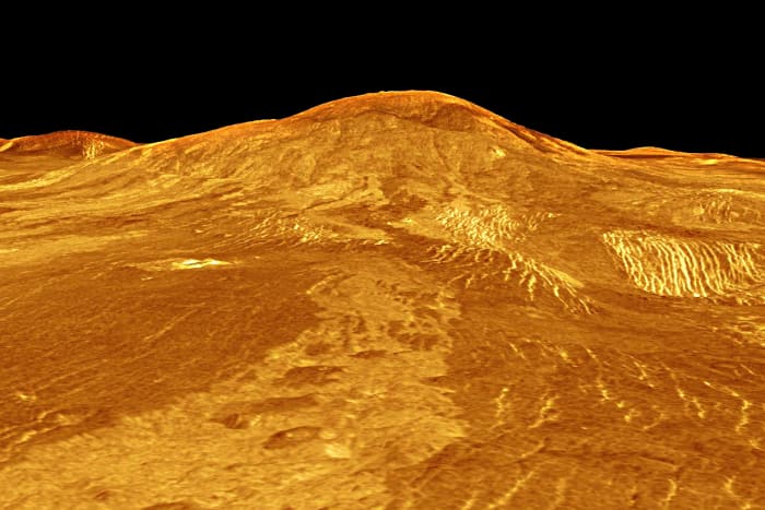 This image features Sif Mons, a 2 km (1.2 mile) high volcano with a diameter of 300 km (180 miles). The lava flow in the foreground extends for hundreds of kilometres