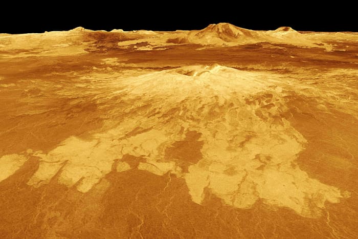Sapas Mons rises 4 km above the surrounding plains of Atla Regio. Lava flows extend for hundreds of kilometers across the fractured plains shown in the foreground to the base of Sapas Mons. At least five volcanoes are known in this region