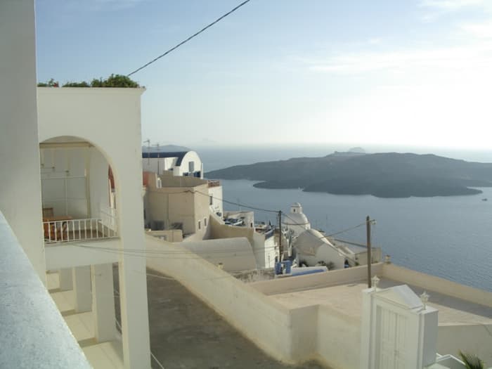 My photo from the cliff-tops of Thera, the largest island in Santorini's ring of islands which are all that's left of a larger island destroyed in 1600 BC. In the middle of the ring is Nea Kameni, the growing volcano that first appeared in 197 BC.