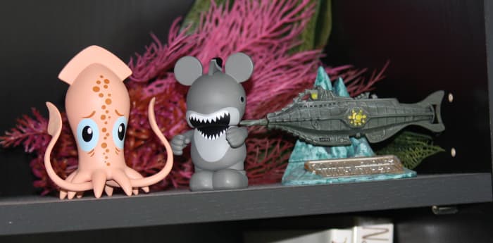 The Park Starz giant squid hanging out with a shark Vinylmation Mickey and a very small Nautilus from Tokyo. (The fake seaweed behind them is salvage from the old 20,000 Leagues ride, or so I'm told.)