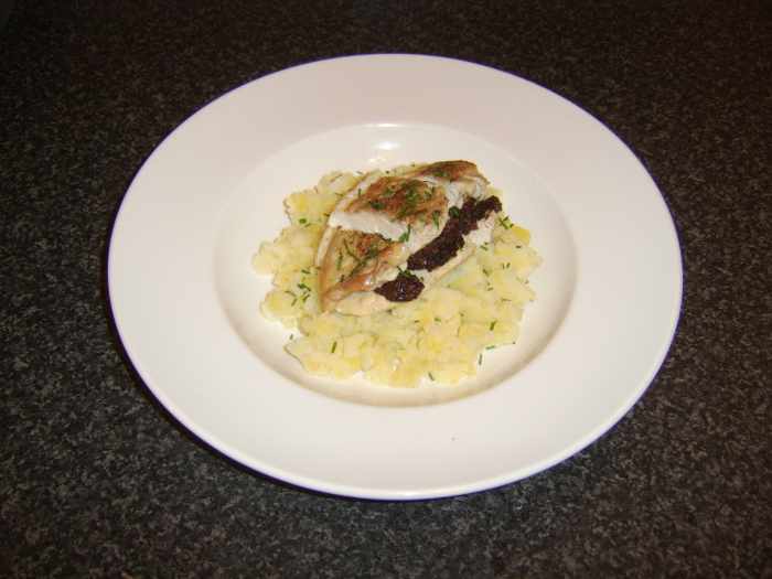 Chicken breast is stuffed with black pudding and baked in the oven, before being served on mashed potato and Swede turnip with chives