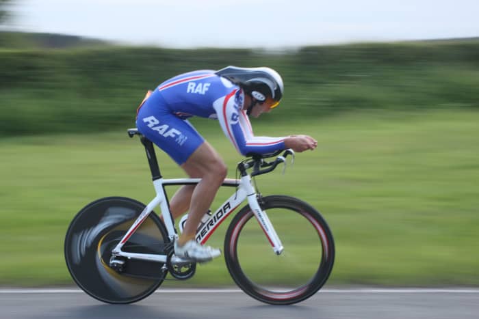 An aero bike helmet can help you towards a faster time trial or triathlon bike leg. This rider is wearing an LAS Crono aero helmet and riding a Merida Time Warp TT Bike