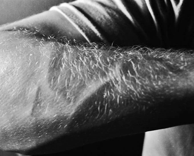 Unless your job or occupation requires you to have no hair on your arms, have some. It looks and feels natural.