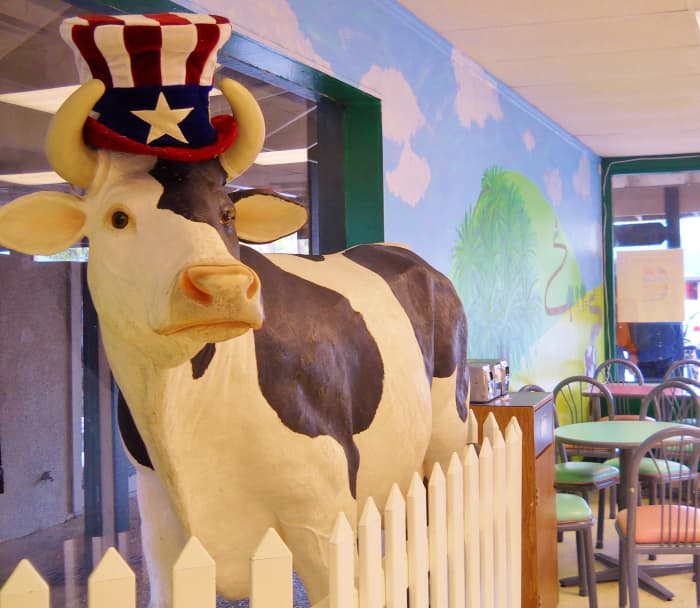 The Frozen Moo has a life size statue of a cow that moos when she feels like welcoming patrons to this colorful ice cream parlor in Coligny Plaza.