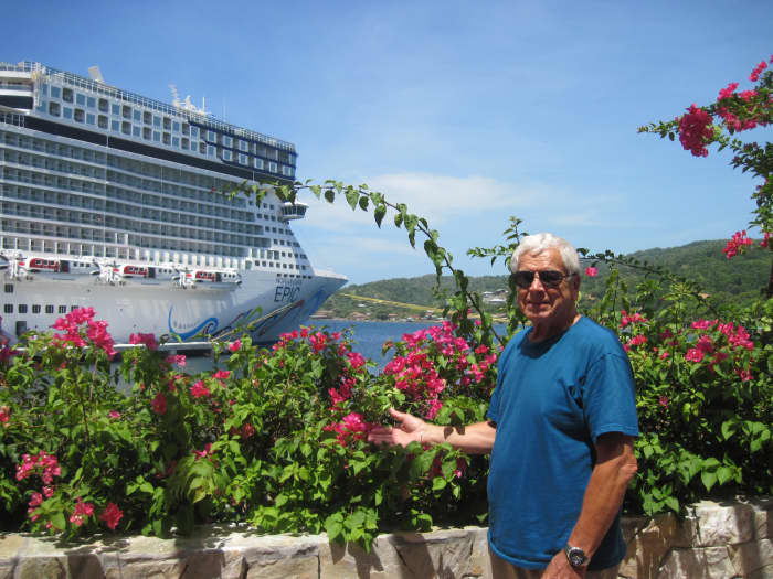 Chuck Hellier on the island of Roatan with the cruise ship Norwegian Epic in the background.