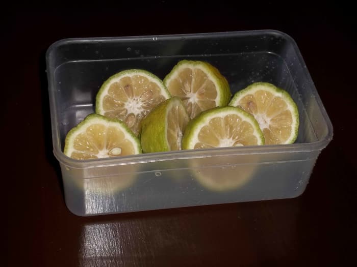 Slice the lemons in half and get the juice out. Use any method you know as long as you squeeze the juice out
