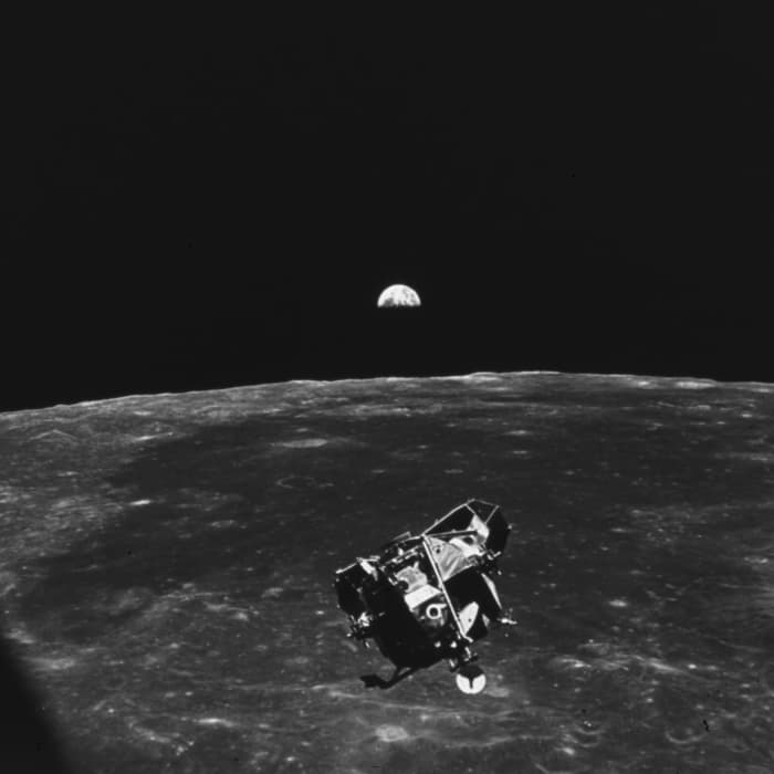 This photo shows the Lunar Module descending toward the surface of the moon after disengaging from the Command Module.