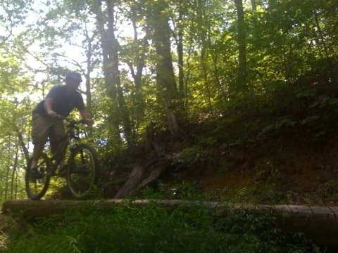 This is me riding one of the log bridge trail features at Bent Creek. Bent Creek is my favorite mountain biking destination.