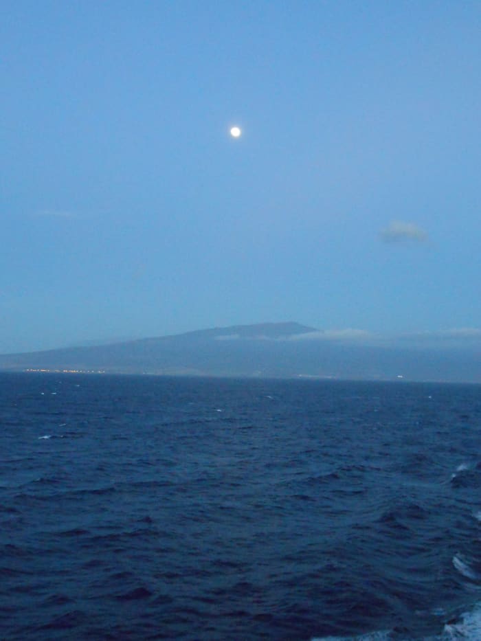 The moon over the island taken just after sunset leaving Kona on the big island on the way to Kauai.