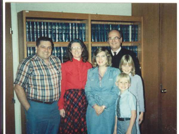 Adoption day family picture with judge and social worker coming between us and our children for the last time -- or so we thought that day.