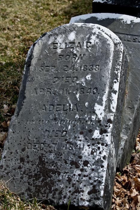 Occasionally, you'll find a marker with several first names only with dates. Looking closely, under the name ADELIA it says "infant daughter". Other inscriptions may tell you the last name, or if the marker is part of a family plot.