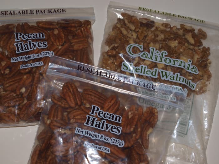 Pecans and walnuts in their original packaging. The bags have been opened so they should be frozen promptly.