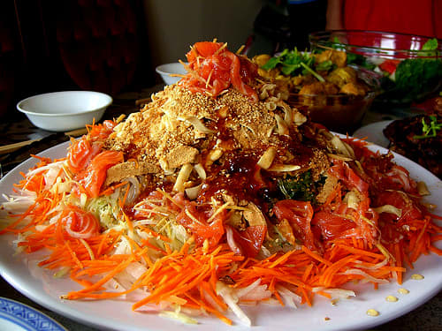 Yee sang or raw fish salad is a Chinese New Year traditional dish in Malaysia and Singapore