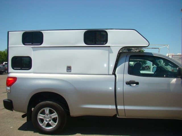This is the Tradesman with the cabover option. The company use to make the Six Pack camper, so they're use to this, but it's not very common. Notice the odd windows, illustrating how custom these can be built.