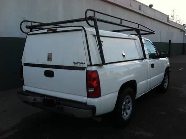 This shell has side doors, solid, including the rear door, and yes, that is optional. Notice the wrap around rack, which you can do, just be sure you measure the doors and distance between the rack legs or the doors wont open.
