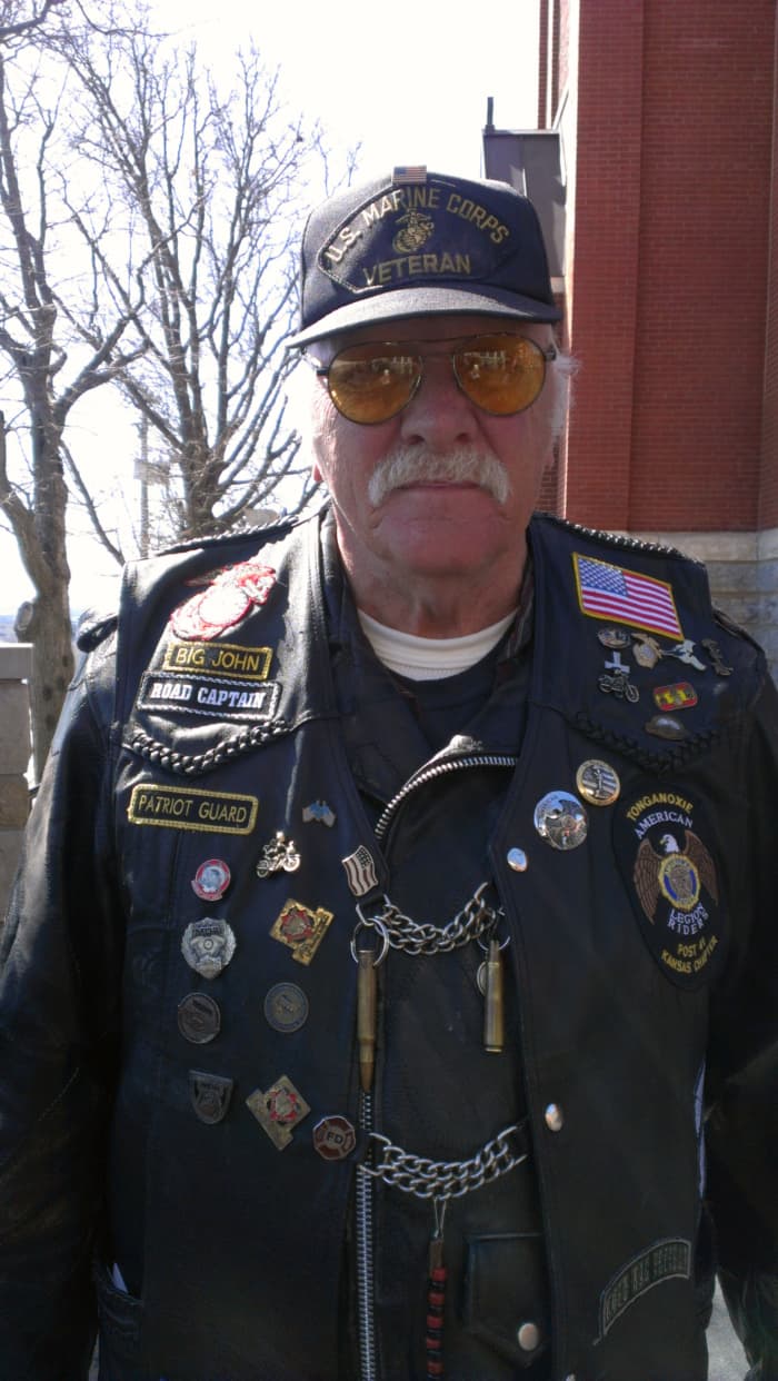 Big John served as a U.S. Marine. He is a member of the American Legion and rides with the Patriot Guard. He helped me understand the Patriot Guard's history. Notice the M-16 bullet and shell on his vest?