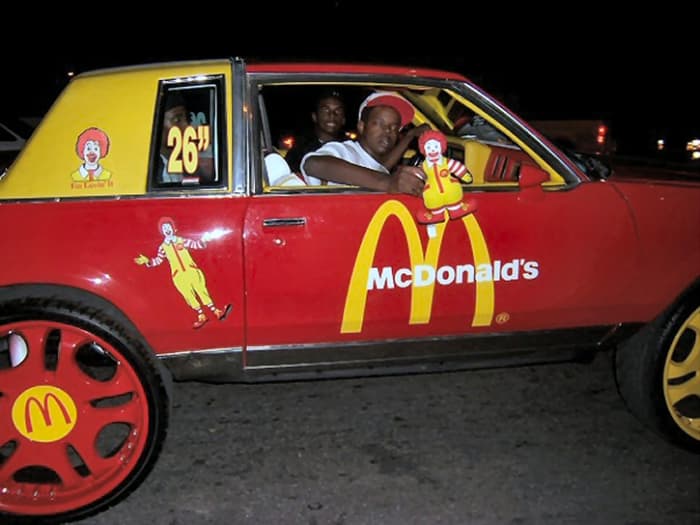 This McDonald's themed Donk is just crazy. It's painted red and yellow to match the McDonald's theme. But, those painted wheels are horrible. Notice how they have to put how big the wheels are on the window.