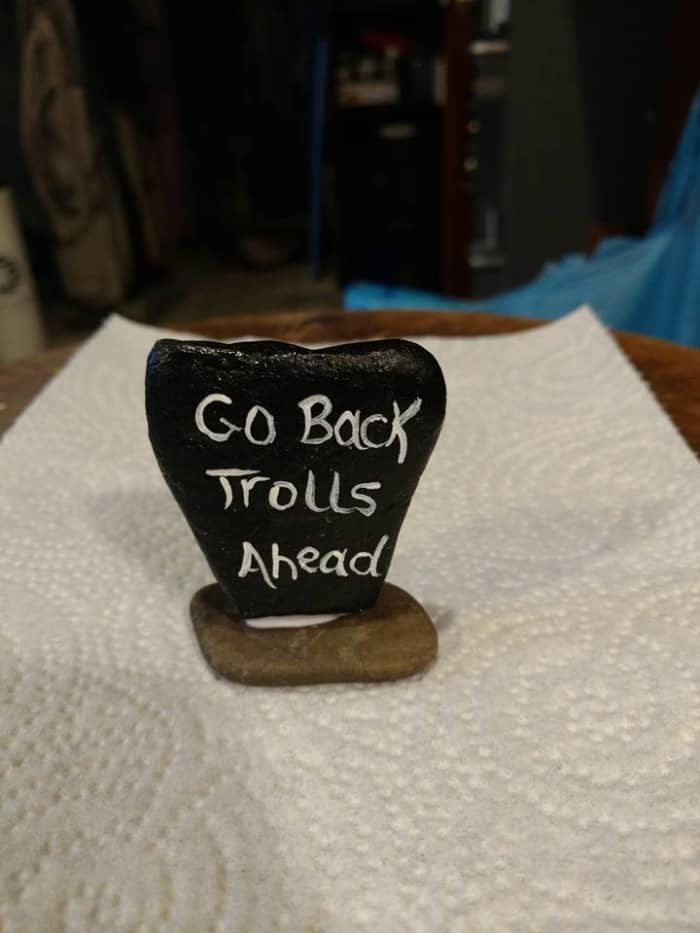 Julie Thomas Cole also makes gravestones and warning signs like this by painting flat rocks. Great creative ideas.