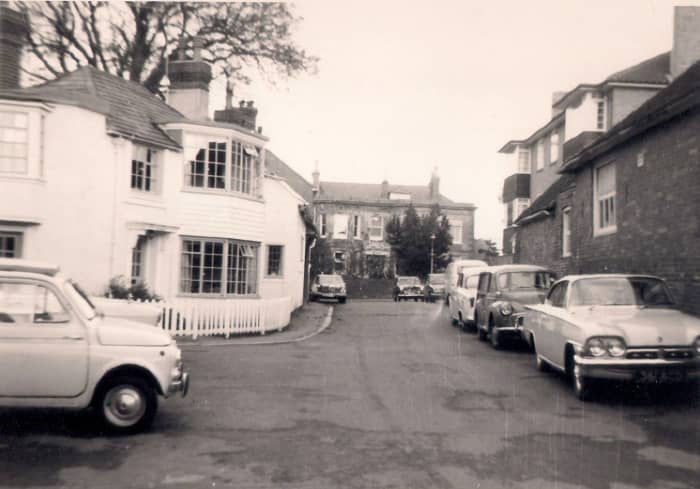the High Street in the background, this lane housed the doctor's surgery and the village hall - Love the Cars!!