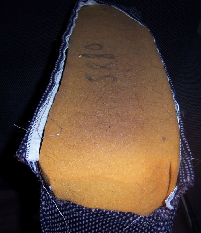 As you can see, this cushion cover is in desperate need of repair. The foam could probably use a lint brush, too.