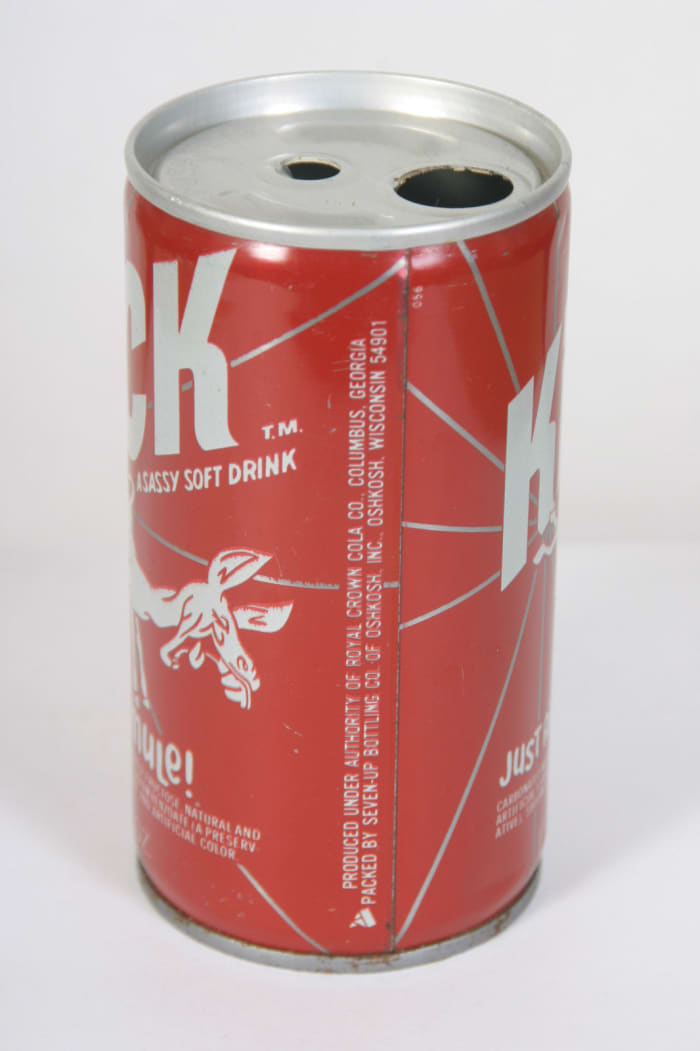 Kick “A Sassy Soft Drink” Kick Like a Mule! Was produced under authority of Royal Crown Cola Co. Columbus, Georgia, and packed by Seven-UP Bottling Co of Oshkosh, Inc. Oshkosh, Wisconsin, 54901.