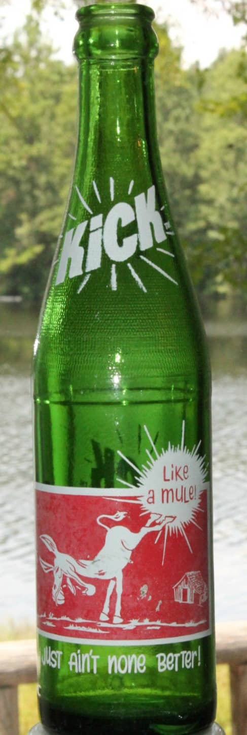 The carbonated citrus flavored soda with the large infusion of caffeine that carried a hillbilly theme on the logo and label of the green glass