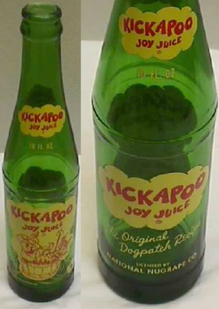 The almost ten inch tall, green glass, with a crown top, ten fluid ounces soft drink "KICKAPOO JOY JUICE" was licensed by National Nugrape Company ans was made in the year 1965. This was the competitor for “Kick like a Mule” by Royal Crown Cola.