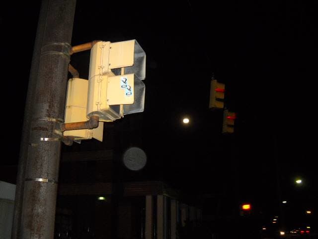 I tried to take a picture of the full moon while we crossed the street. Looks like an orb wanted a look as well.