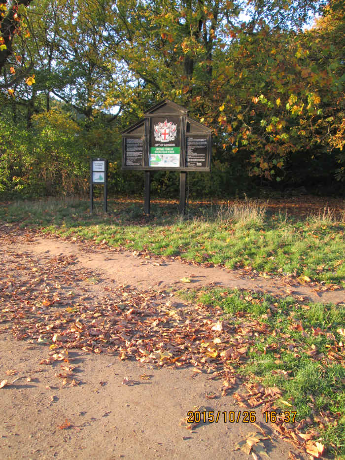 Near where a barrier stood between gateposts, a City of London Corporation board lists bylaws and instructions, mostly ignored. There are hardly ever any constables seen here to enforce by bylaws or police the park