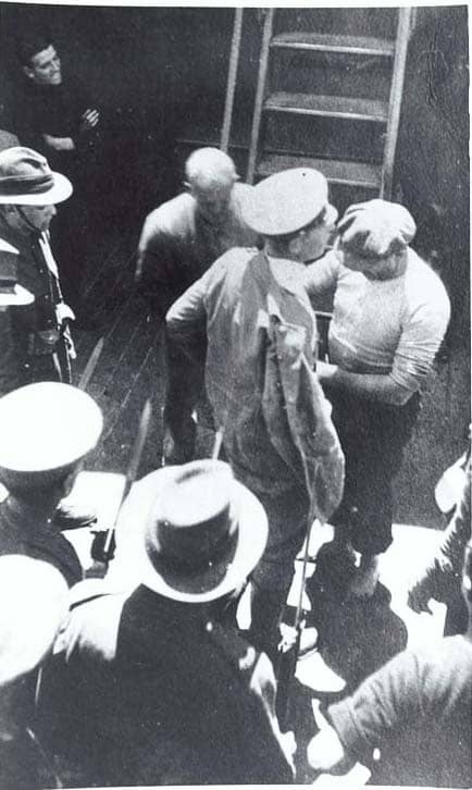WW1: Luckner being searched on Iris after being recaptured after escaping from an internment camp in December 1917.