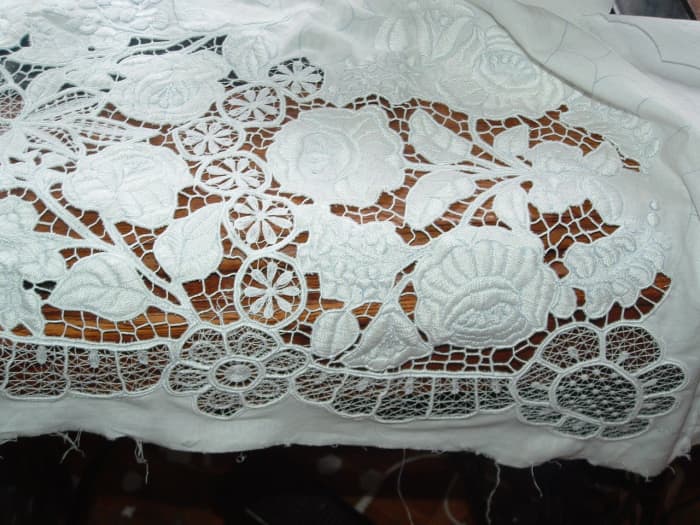 Before colorfast dyes became available, the embroidery work of this region was the white and cutwork pattern as seen on this piece of fine work.