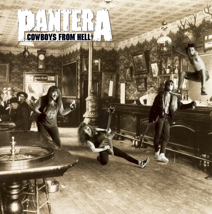 The cover shows the band members of Pantera having fun at a bar or saloon. Vocalist Phil Anselmo is shown at the top right of the photo as he is in the air celebrating.