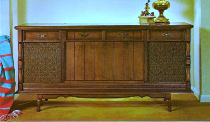 The Columbine, model 44M310, Genuine Maple veneer and selected hardwood solids. Dimensions: 62 inches long, 30 3/4 high, with custom stereo sound system and four speakers. Retail price $249.95.