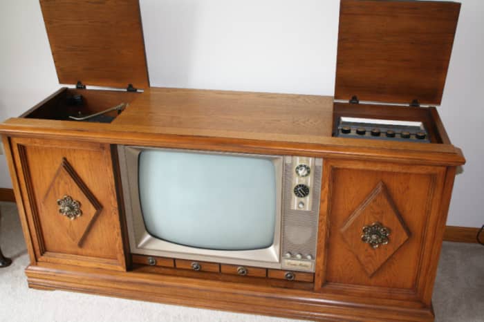 A Beautiful Curtis Mathes three in one color television console from 1967. With a deluxe AM & FM Curtis Mathes Stereo system and turntable. With hand made in Texas speakers and hand rubbed wooden cabinet.