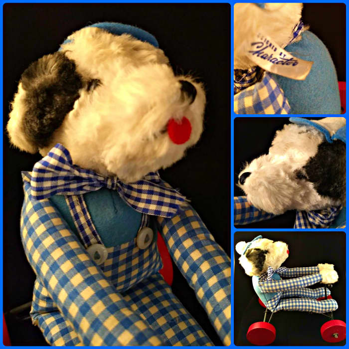 Felt tongue and embroidered nose and mouth in excellent condition. His button eyes are in great shape as well! The black metal fame and red wheels are in excellent shape and the record mechanism works smoothly.