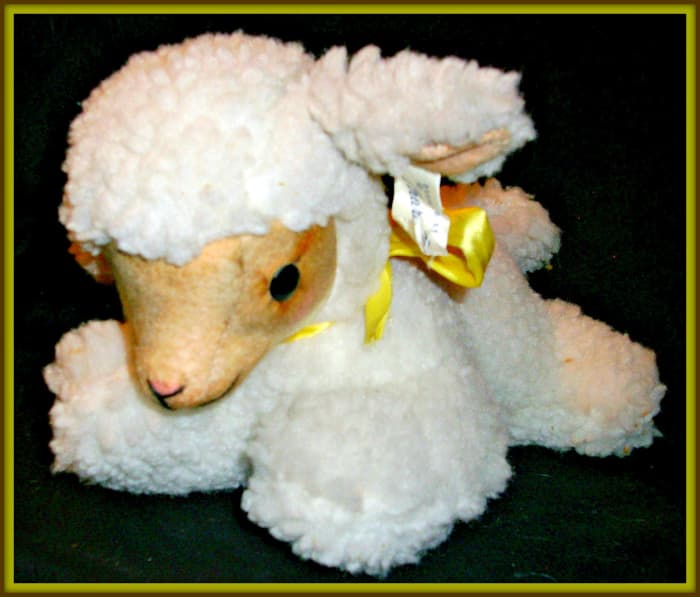 Character Novelty Co. Easter or nursery Lamb that plays Music. She measures about twelve inches long, and when you wind her up and she plays "Rock A Bye Baby" :)
