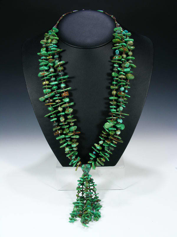 Turquoise necklace - large turquoise mixed with brown heishi and a jocla hangling from center