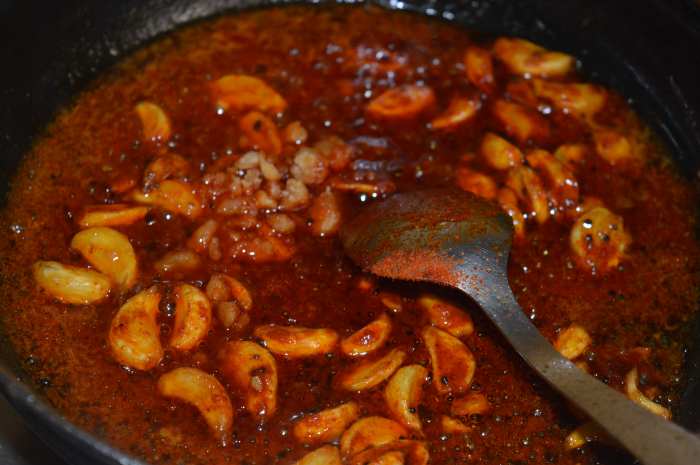 Step five: Throw in powdered jaggery. Let the mixture boil and combine with the other ingredients in the pan.