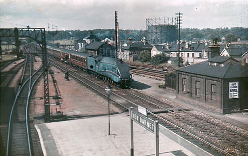 New Barnet Station in pre-WWII days and the scene of a well-rehearsed evacuation from North London districts in early September, 1939 - an LNER 'Streak' (Class A4 Pacific) heads for King's Cross Station, London with an evening express