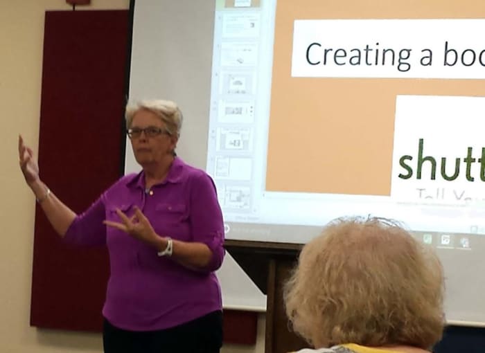 Here I'm giving a talk about creating a family history book using Shutterfly or Blurb.