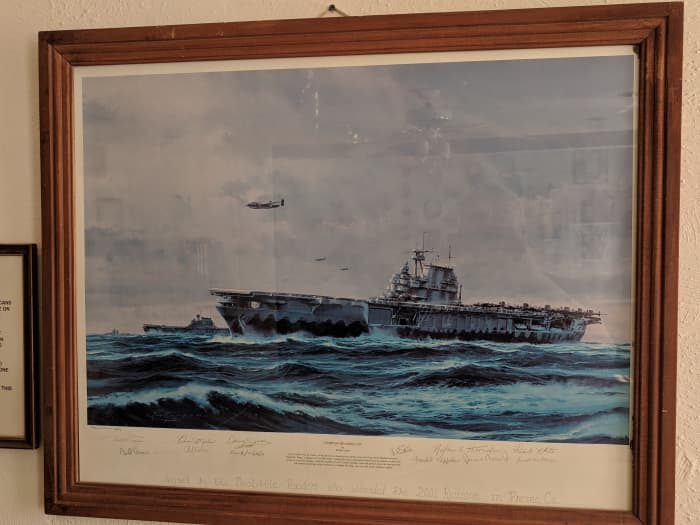 Picture of Painting by Robert Taylor titled "Compass Heading 270°" depicting Aircraft Carrier Hornet with Lt Col Doolittle (first off) overflying ship while other prepare to launch. Painting from 2001 Raiders Reunion signed by all in attendance